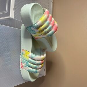 Cute sandals never worn too big. Would be great for wide feet.